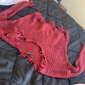 a semi cropped thread sweater